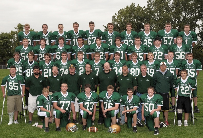 1st Row (L to R): Luke Fischer, Jon Kopacek, Cody Gilliland, Nathan Lax, Jay Helget, Elliot Braun 2nd Row (L to R): Cody Berkner, Coach Mark Simon, Coach Dan Schmid, Coach Dustin Mangen, Head Coach Brent Kucera, Coach Matt Andres, Coach Nick Novotny, Coach Mark Tauer, Coach Seth Fevold, Cole Reinarts 3rd Row (L to R): Jared Rothmeier, Mike Fischer, Jake Lilleodden, Zach Miller, Brady Hansen, Scott Salfer, Lauri Vuoerenpae, Tanner Weiss, Payton Adams, Dylan Owens, Jaden Wait 4th Row (L to R): Josh Kopacek, Mitch Neid, Eric Goblirsch, Mike Zinniel, Nolan Helget, Lucas Heiderscheidt, Jared Kuebler, James Pulley, Kyle Krzmarzick 5th Row (L to R): Alex Mages, Brandon Helget, John Brandl, Jordan Anderson, Andrew Steffl, Sean Mathiowetz, Mike Hirsch, Joe Meyer, Carter Krzmarzick, Adam Sellner Not Pictured: David Surprenant