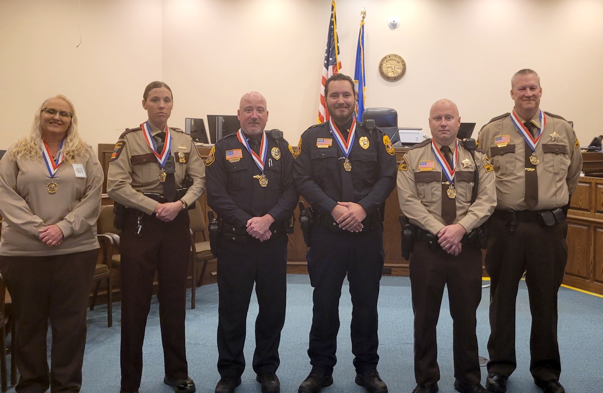 Law enforcement officers presented Award of Valor and Merit